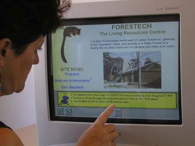 Photograph of client using touchscreen & EIA Browser